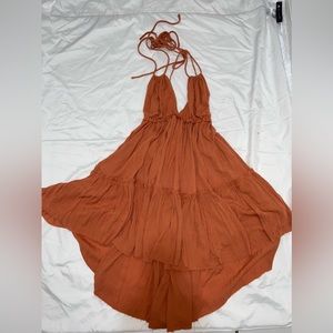 Coral color flowing dress.